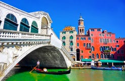 Rialto bridge with Gondola underneath in Venice, Italy