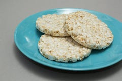Rice bread on a blue plate stock photos Rice bread on a blue plate stock photos