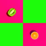 Ripe juicy halved orange kiwi on duotone bright neon fuchsia pink green background with blank squares for text royalty free stock photography Ripe juicy halved orange kiwi on duotone bright neon fuchsia pink green background with blank squares for text royalty free stock photography