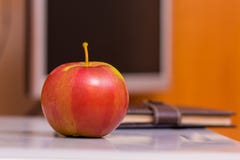 Ripe juicy red apple on the background of the computer. Useful f royalty free stock photos Ripe juicy red apple on the background of the computer. Useful f royalty free stock photos