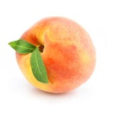 Ripe peach fruit with green leafs isolated