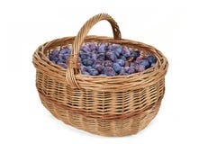 Ripe Plums In Basket Stock Images