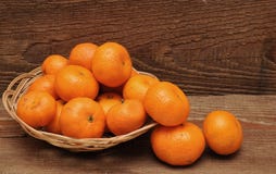 Ripe Tangerine Fruits In Basket Stock Images