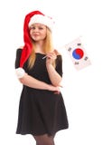 Ritratto di bella giovane donna che porta un vestito nero in un cappello di Santa con una bandiera in mani isolate su un bianco immagine stock Ritratto di bella giovane donna che porta un vestito nero in un cappello di Santa con una bandiera in mani isolate su un bianco immagine stock