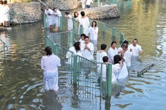 The ritual baptism of Christian pilgrims in the Jordan River