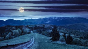Road through the meadow on hillside at night royalty free stock photography Road through the meadow on hillside at night royalty free stock photography