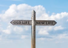 Road sign with old life and new life direction against sky Stock Images Road sign with old life and new life direction against sky Stock Images