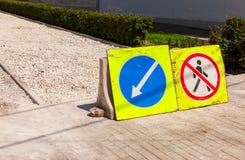 Road signs at the under construction sidewalk Stock Photo Road signs at the under construction sidewalk Stock Photo