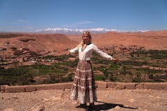 Girl in front of the panoramic view of the High Atlas Mountains royalty free stock photography Girl in front of the panoramic view of the High Atlas Mountains royalty free stock photography