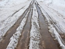 Road With Melting Snow Royalty Free Stock Photo