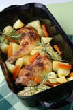 Roast Chicken Legs With Potatoes And Vegetable Stock Photo