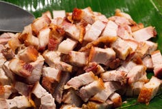 Roast Pork Cut Into Pieces On Palm Leaf Stock Image