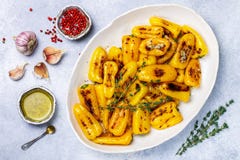 Delicatessen appetizer of roasted bell peppers with garlic, thyme and spices stock image Delicatessen appetizer of roasted bell peppers with garlic, thyme and spices stock image