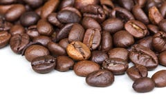 Roasted coffee beans isolated on a white background. stock image Roasted coffee beans isolated on a white background. stock image