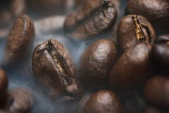 Roasted coffee beans with smoke. Coffee Background royalty free stock photography Roasted coffee beans with smoke. Coffee Background royalty free stock photography