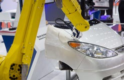 Robot measuring the flush and gap between assembled parts of car royalty free stock photography Robot measuring the flush and gap between assembled parts of car royalty free stock photography