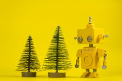 Robot on a yellow background stock images Robot on a yellow background stock images