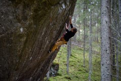 Rock climber on a challenging ascent. Extreme climbing. Unique winter sports. Scandinavian nature. stock image Rock climber on a challenging ascent. Extreme climbing. Unique winter sports. Scandinavian nature. stock image
