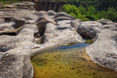 Rocks eroded by the river Tastavins before forming the waterfall Stock Photos Rocks eroded by the river Tastavins before forming the waterfall Stock Photos