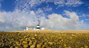 Rocks and lighthouse stock image Rocks and lighthouse stock image