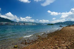 Rocky beach with building, cloud and blue sky. In day time Stock Image Rocky beach with building, cloud and blue sky. In day time Stock Image