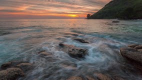 Rocky beach sunset panorama phuket island 4k time lapse thailand stock video Rocky beach sunset panorama phuket island 4k time lapse thailand stock video