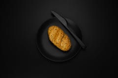 A roll on a black plate royalty free stock images A roll on a black plate royalty free stock images