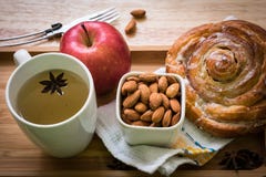 Cinnamon Roll breakfast apple and tea wooden backgroud stock photography Cinnamon Roll breakfast apple and tea wooden backgroud stock photography
