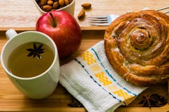 Cinnamon Roll breakfast apple and tea wooden backgroud royalty free stock photography Cinnamon Roll breakfast apple and tea wooden backgroud royalty free stock photography