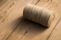 A roll of twine on a wooden background. Selelective focus. Close-up. Free space for text. royalty free stock photos A roll of twine on a wooden background. Selelective focus. Close-up. Free space for text. royalty free stock photos