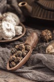 Rolled tea leaves into a large pearl. Chinese tea from Yunnan province. Biluochun. Tea ceremony royalty free stock image Rolled tea leaves into a large pearl. Chinese tea from Yunnan province. Biluochun. Tea ceremony royalty free stock image