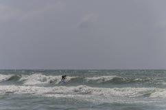 ROMA, ITALY - AUGUST 2018: Surf rides a wave on the sea royalty free stock photos ROMA, ITALY - AUGUST 2018: Surf rides a wave on the sea royalty free stock photos