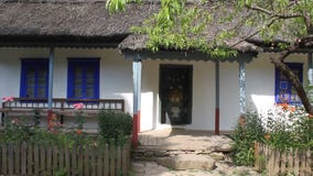 Romanian household. Courtyard and wooden fence Romanian household. Courtyard and wooden fence