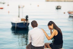 Romantic couple having relationship problems.Woman crying and begging a man.Fisherman life,dangerous occupation.Navy sailors royalty free stock photos Romantic couple having relationship problems.Woman crying and begging a man.Fisherman life,dangerous occupation.Navy sailors royalty free stock photos