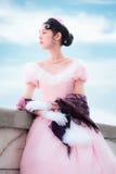 Romantic girl in evening dress is standing on the balcony. Royalty Free Stock Photo Romantic girl in evening dress is standing on the balcony. Royalty Free Stock Photo