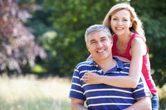 Romantic Middle Aged Couple Walking In Countryside royalty free stock image Romantic Middle Aged Couple Walking In Countryside royalty free stock image