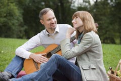 https://thumbs.dreamstime.com/t/romantic-picnic-man-playing-guitar-10899889.jpg