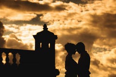 Romantic young couple on the fortress wall at sunset stock photos Romantic young couple on the fortress wall at sunset stock photos