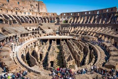 ROME, ITALY - APRIL 24, 2017. Inside view of The Colosseum with tourists sightseeing. Stock Photo ROME, ITALY - APRIL 24, 2017. Inside view of The Colosseum with tourists sightseeing. Stock Photo