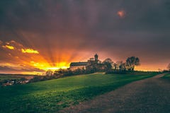 Landscape shot, medieval Ronneburg Castle with rape fields in spring at sunrise, Wetterau, Hesse, Germany