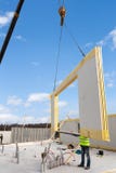 Roofer builder worker with crane installing structural Insulated Panels SIP. Building new frame energy-efficient house. Stock Image Roofer builder worker with crane installing structural Insulated Panels SIP. Building new frame energy-efficient house. Stock Image