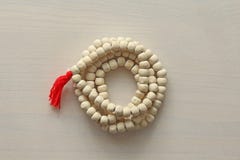 Rosary or beads from the sacred tree of Tulasi with a red tassel stock photography Rosary or beads from the sacred tree of Tulasi with a red tassel stock photography