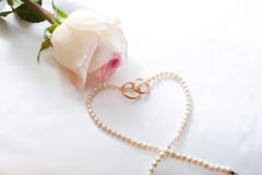 Rose, Wedding Rings, Perl Necklace Stock Photo Rose, Wedding Rings, Perl Necklace Stock Photo