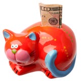 Rotes moneybox auf einem weißen Hintergrund stockfoto Rotes moneybox auf einem weißen Hintergrund stockfoto