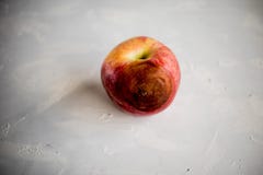 A rotten red apple on a white background royalty free stock photo A rotten red apple on a white background royalty free stock photo