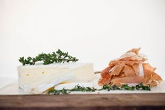 A round of brie and prosciutto royalty free stock photography A round of brie and prosciutto royalty free stock photography