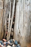 Round Rocks And Aged Wood Stock Photo