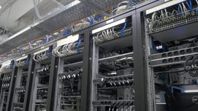 Device for mining crypto currency. Row of bitcoin miners set up on the wired shelfs. Mining cryptocurrency. Bitcoin farm Stock Images Device for mining crypto currency. Row of bitcoin miners set up on the wired shelfs. Mining cryptocurrency. Bitcoin farm Stock Images