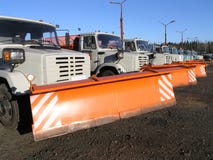 Row of new snow plows stock photo Row of new snow plows stock photo