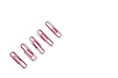 A row of pink paper clips stock photo A row of pink paper clips stock photo